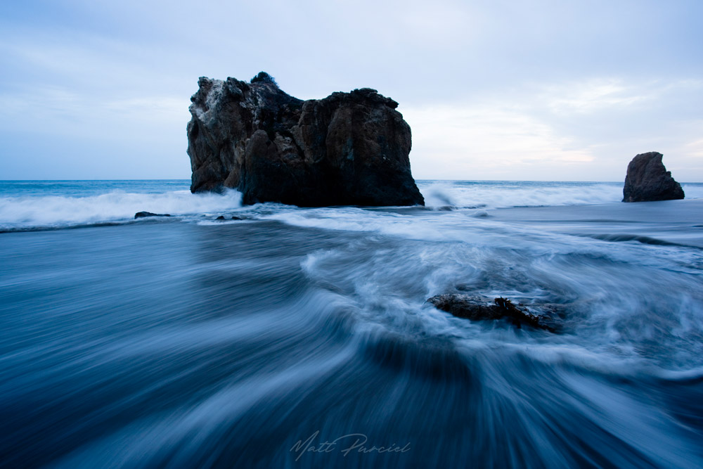 El Matador State Beach in Malibu with dramatic sea caves, massive rocks, and high surf along the California coast